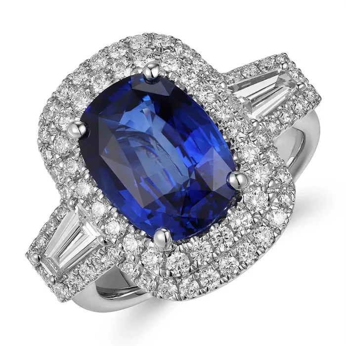 Meierotto Jewelers 18K White Gold Elongated Cushion Sapphire with Double Diamond Halo Ring with Tapered Baguette Diamond Sides Rings Meierotto Jewelers 18K White Gold Elongated Cushion Sapphire with Double Diamond Halo Ring with Tapered Baguette Diamond Sides Rings